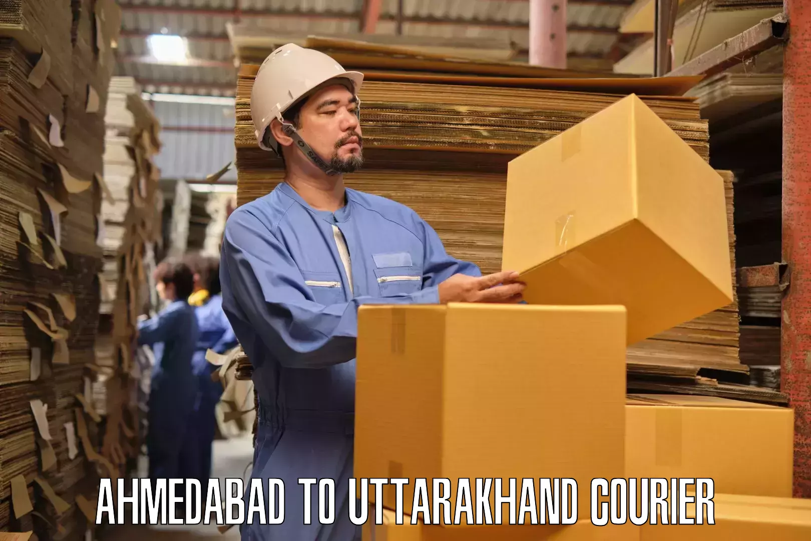 Professional home goods transport Ahmedabad to Uttarkashi
