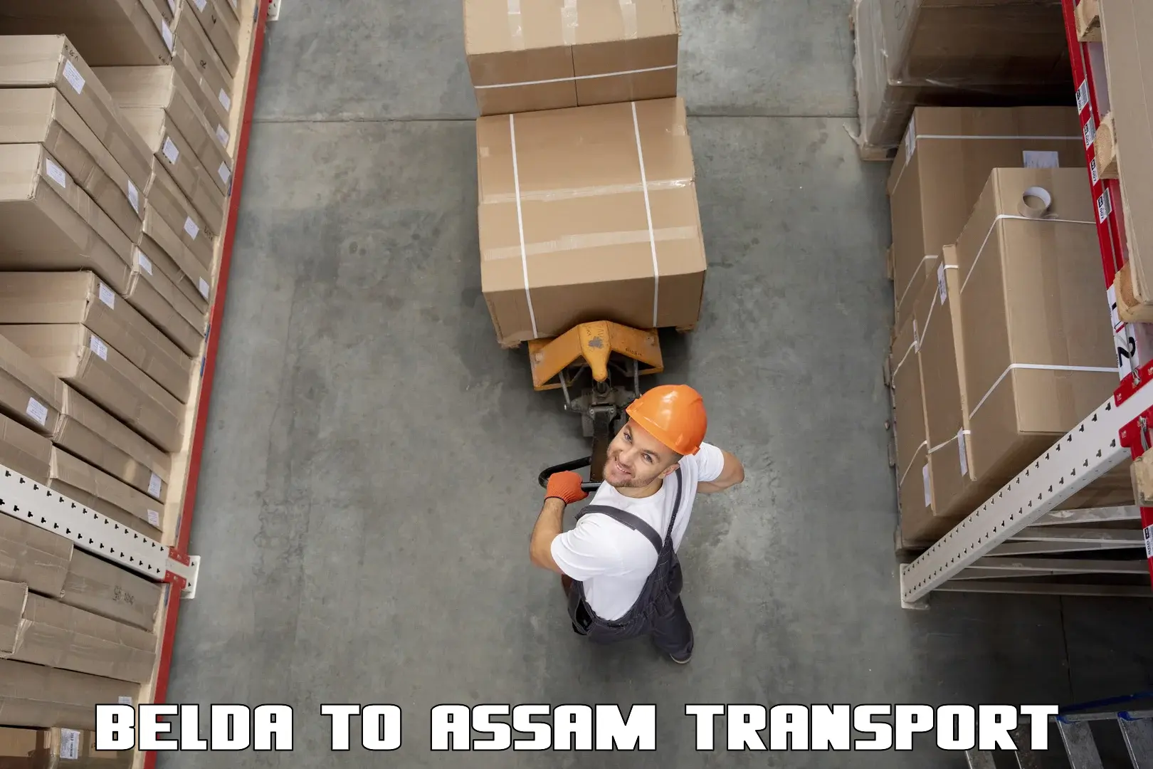 Two wheeler transport services Belda to Lala Assam